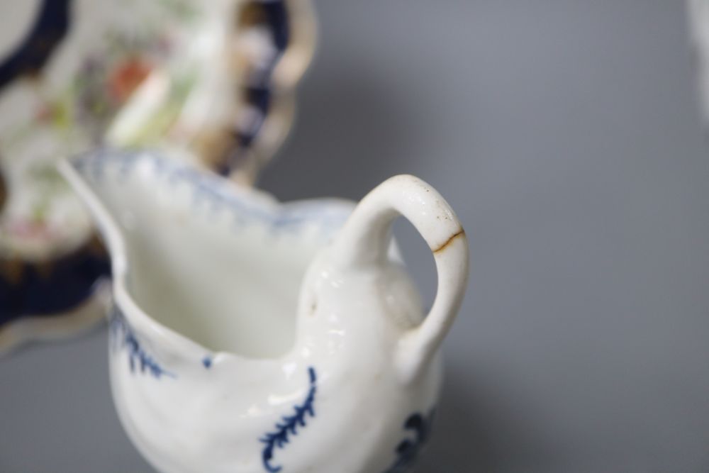 An 18th century Worcester blue scale plate, diameter 19.5cm and a sauceboat
